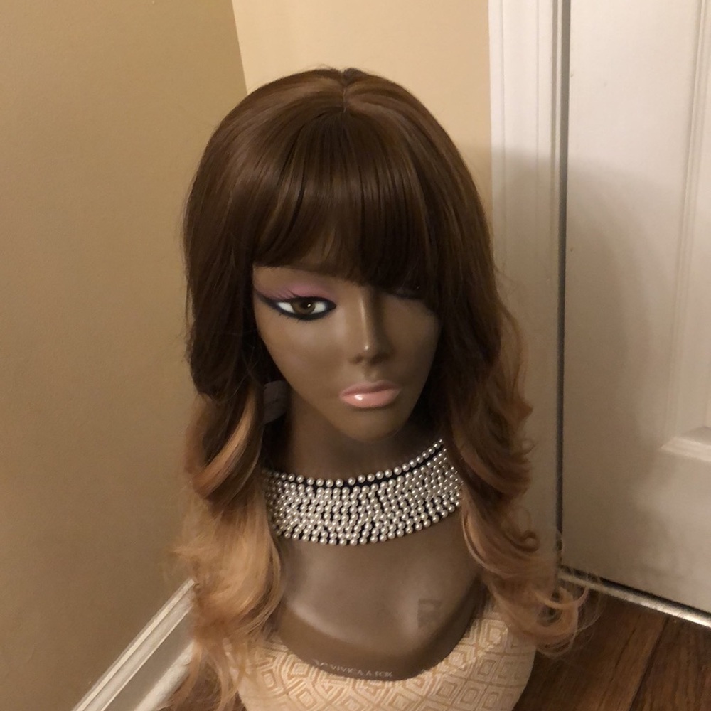 Brand new stylish wig by bogsea. With bangs and body wave curls